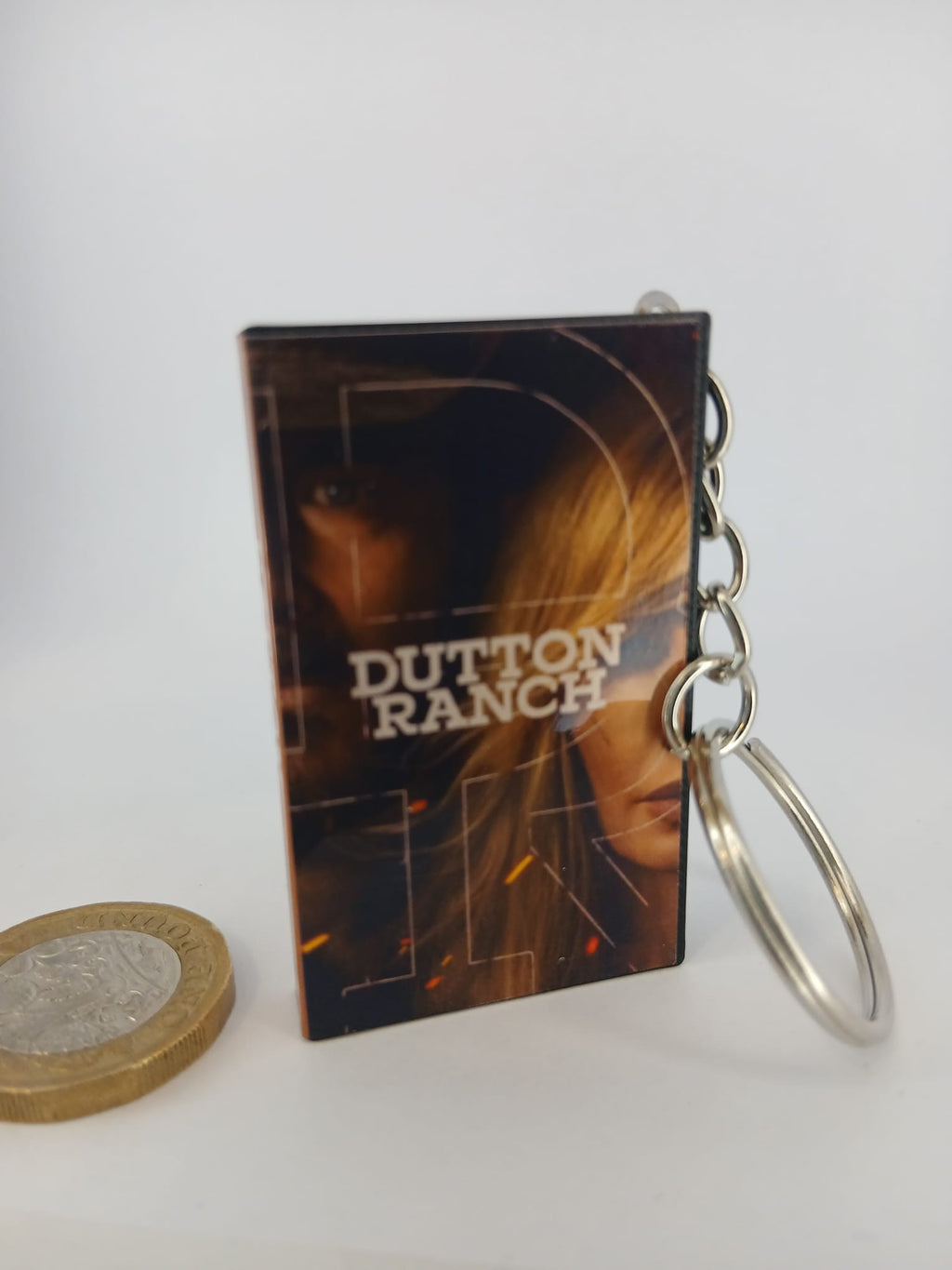 Dutton Ranch VHS keyring — spine view standing