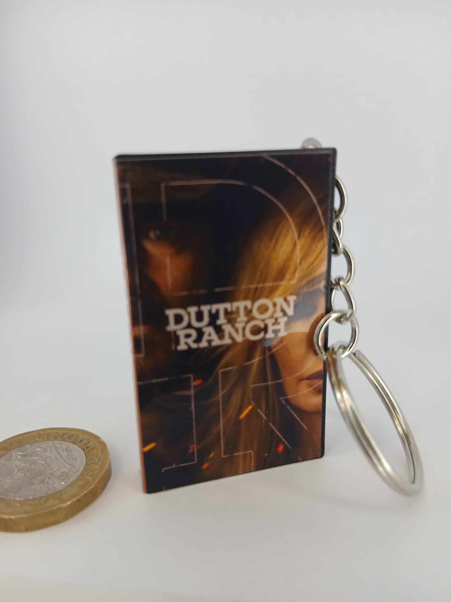 Dutton Ranch VHS keyring — spine view standing