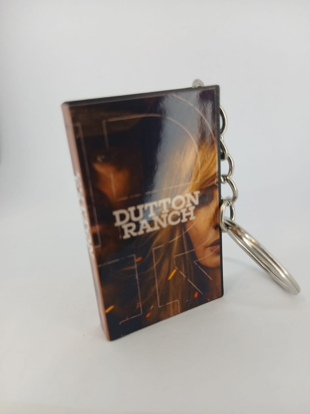 Dutton Ranch VHS keyring — back cover angled view standing
