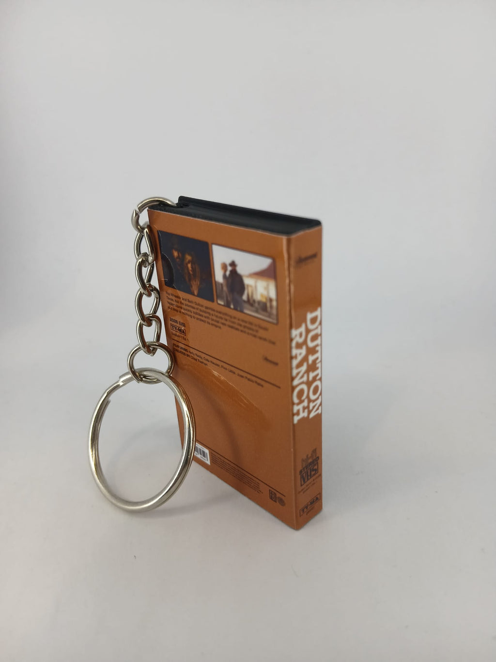 Dutton Ranch VHS keyring — front cover flat lay angled close-up