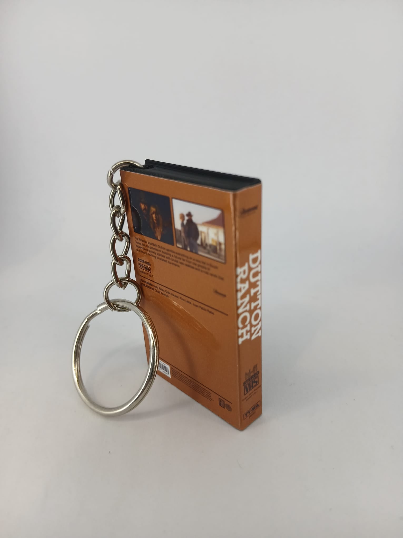 Dutton Ranch VHS keyring — front cover flat lay angled close-up