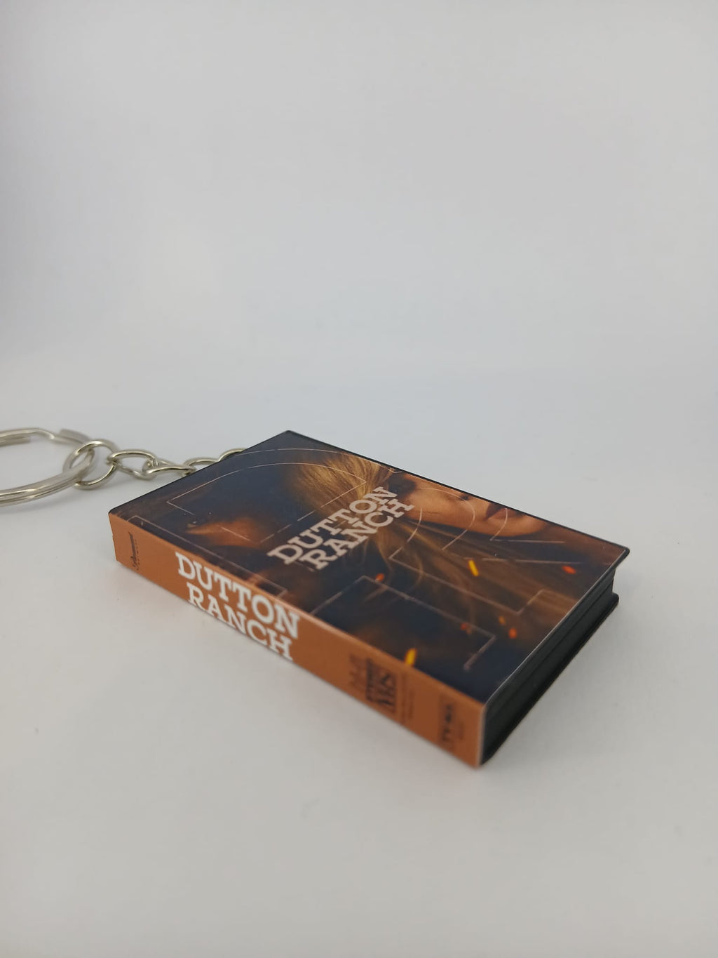 Dutton Ranch VHS keyring — front cover flat lay angled 3