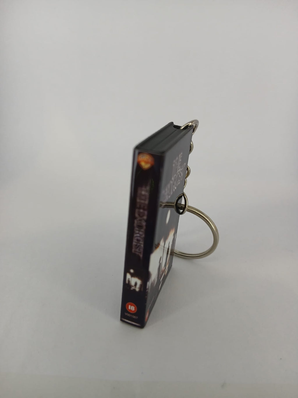 The Exorcist VHS keyring — front cover standing angled
