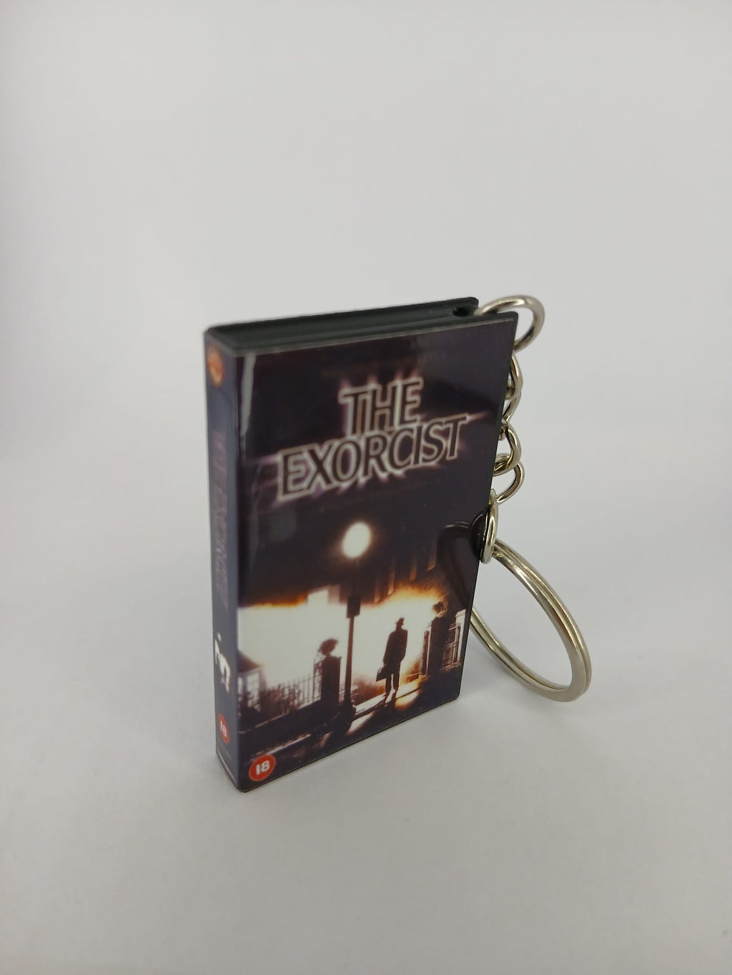 The Exorcist VHS keyring — back cover angled view standing