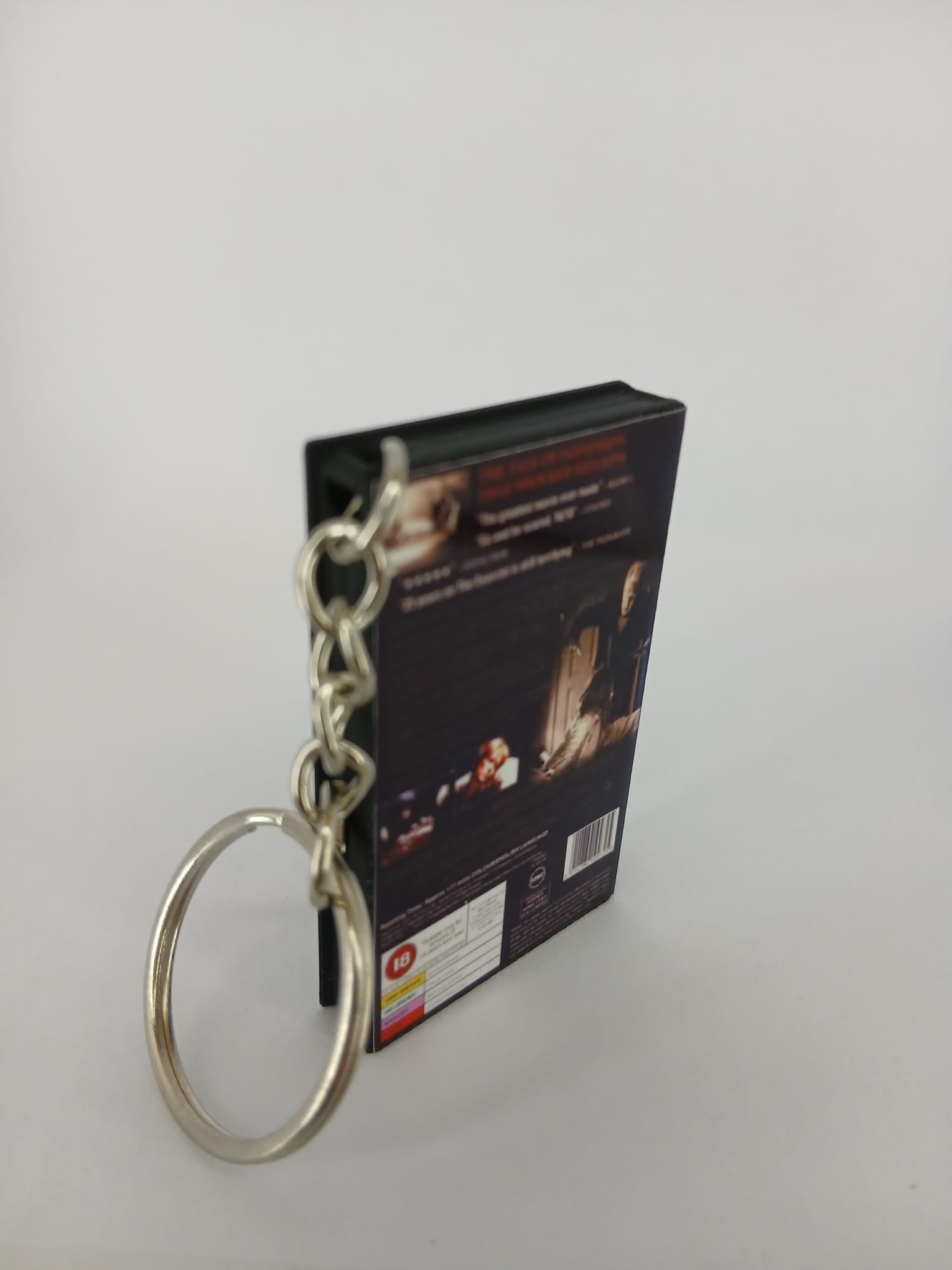 The Exorcist VHS keyring — back cover standing angled 2
