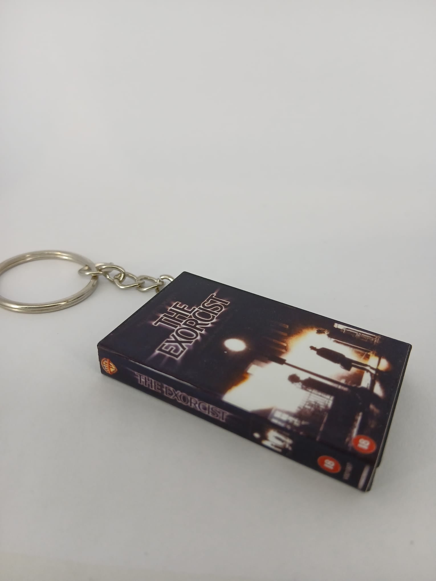 The Exorcist VHS keyring — front cover standing angled 2