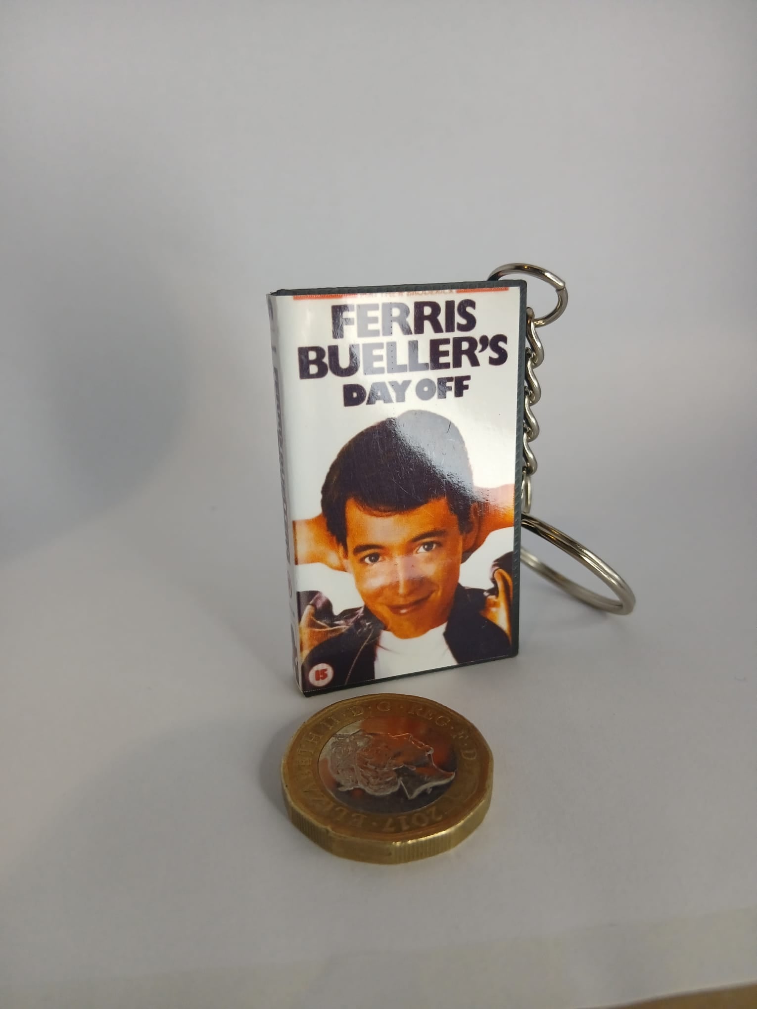Ferris Bueller's Day Off VHS keyring size comparison with coin