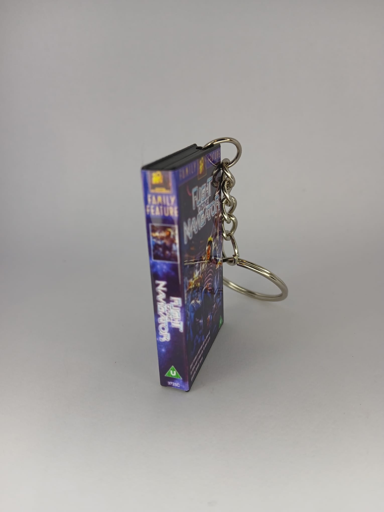 Flight of the Navigator Mini VHS Keyring – front with coin standing