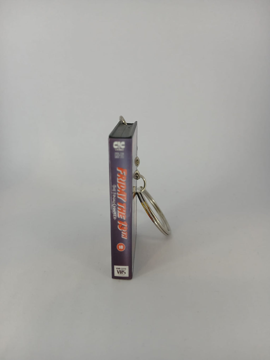 Friday the 13th The Final Chapter VHS keyring — flat lay top view
