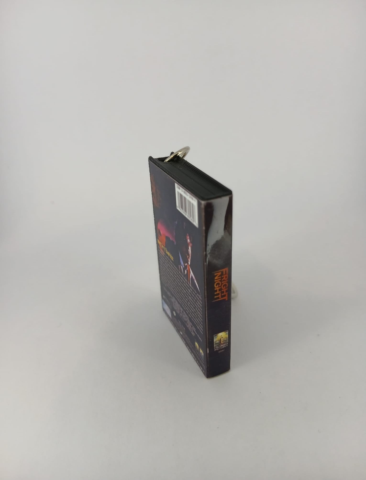 Fright Night VHS keyring — front and spine angled view standing