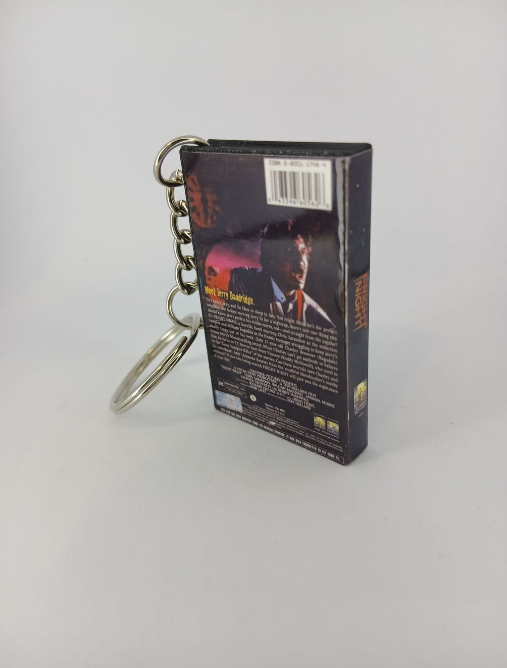 Fright Night VHS keyring — flat lay overhead showing full wrap