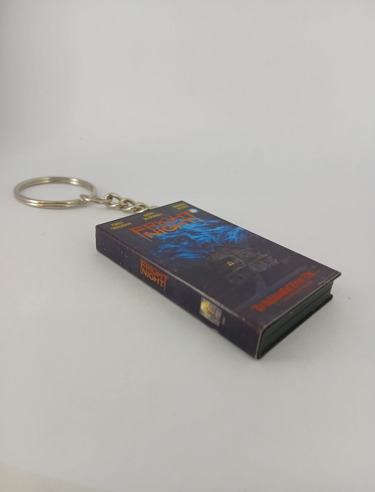 Fright Night VHS keyring — spine view standing