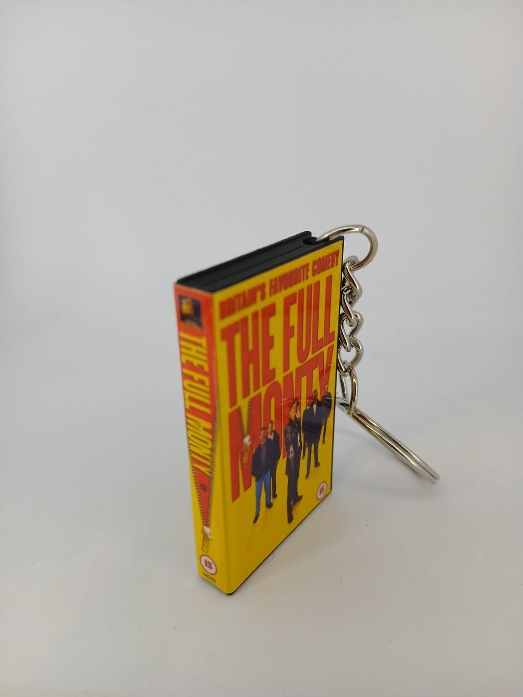 The Full Monty VHS keyring — flat lay front and spine angled
