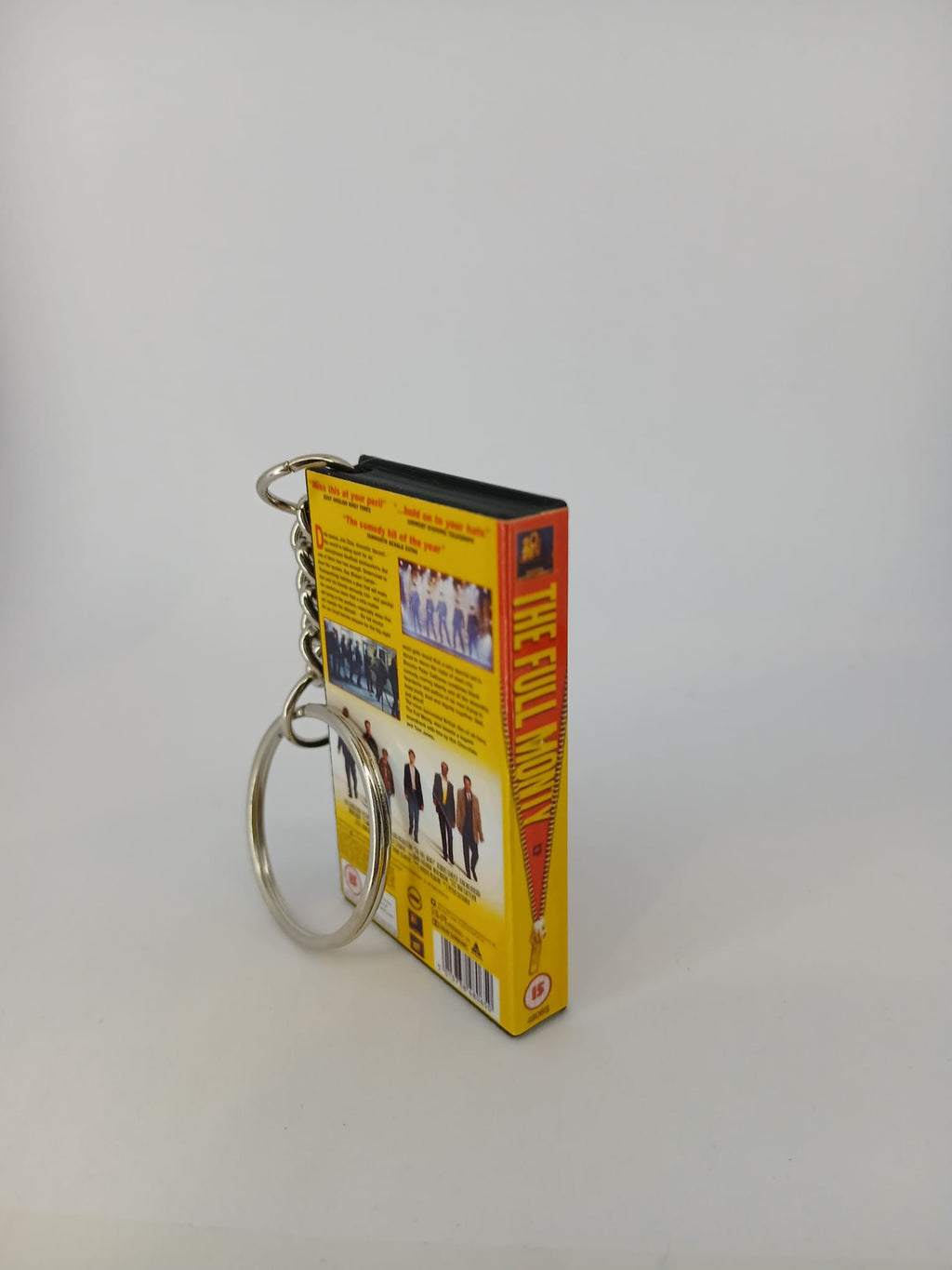 The Full Monty VHS keyring — spine view standing