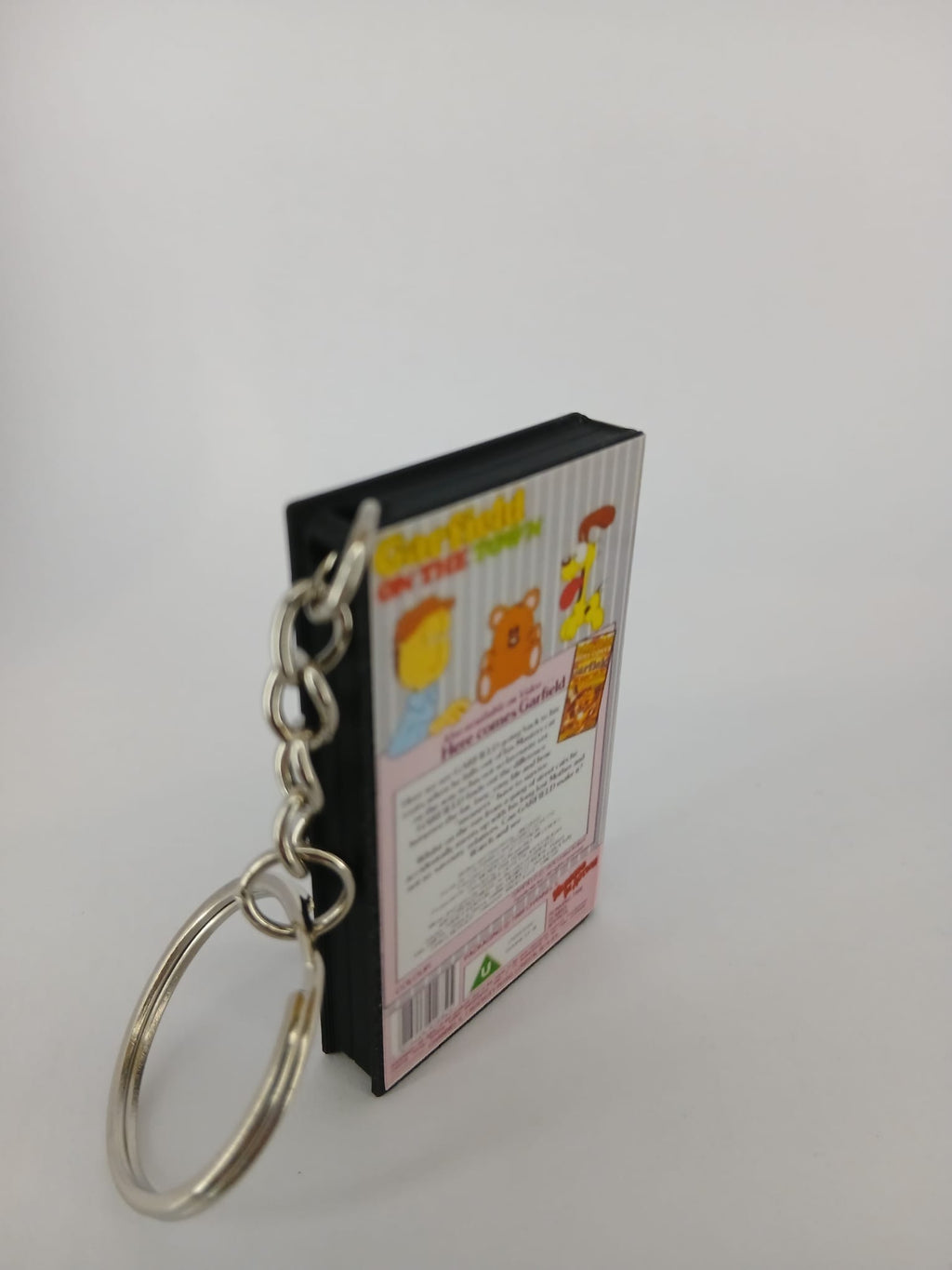Garfield on the Town VHS keyring — flat lay front and spine angled