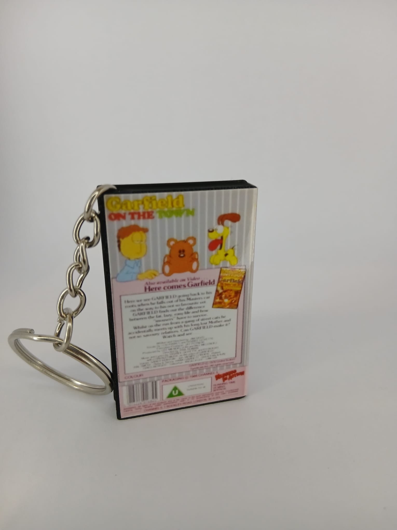 Garfield on the Town VHS keyring — spine view standing
