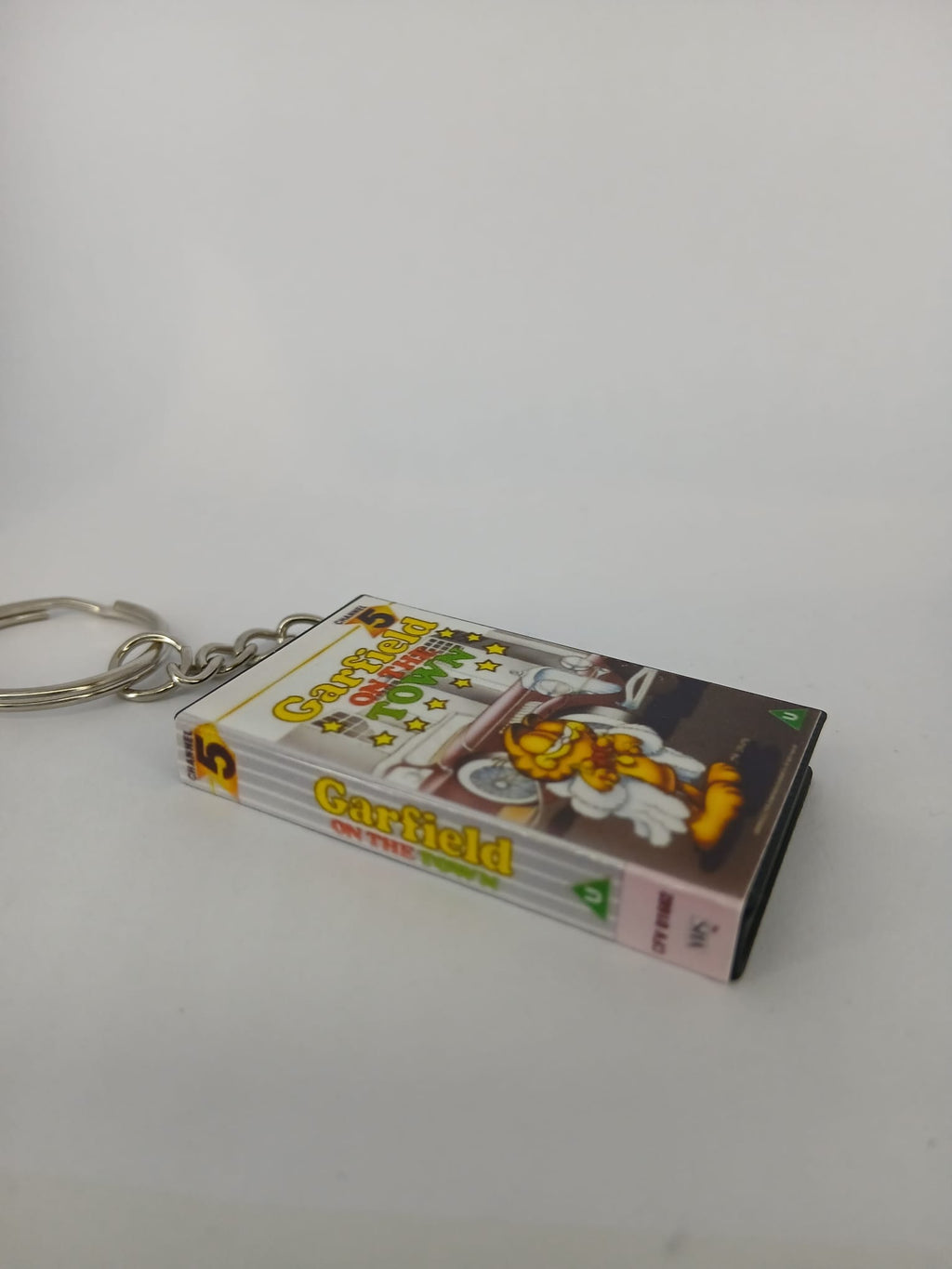 Garfield on the Town VHS keyring — front and spine angled view standing