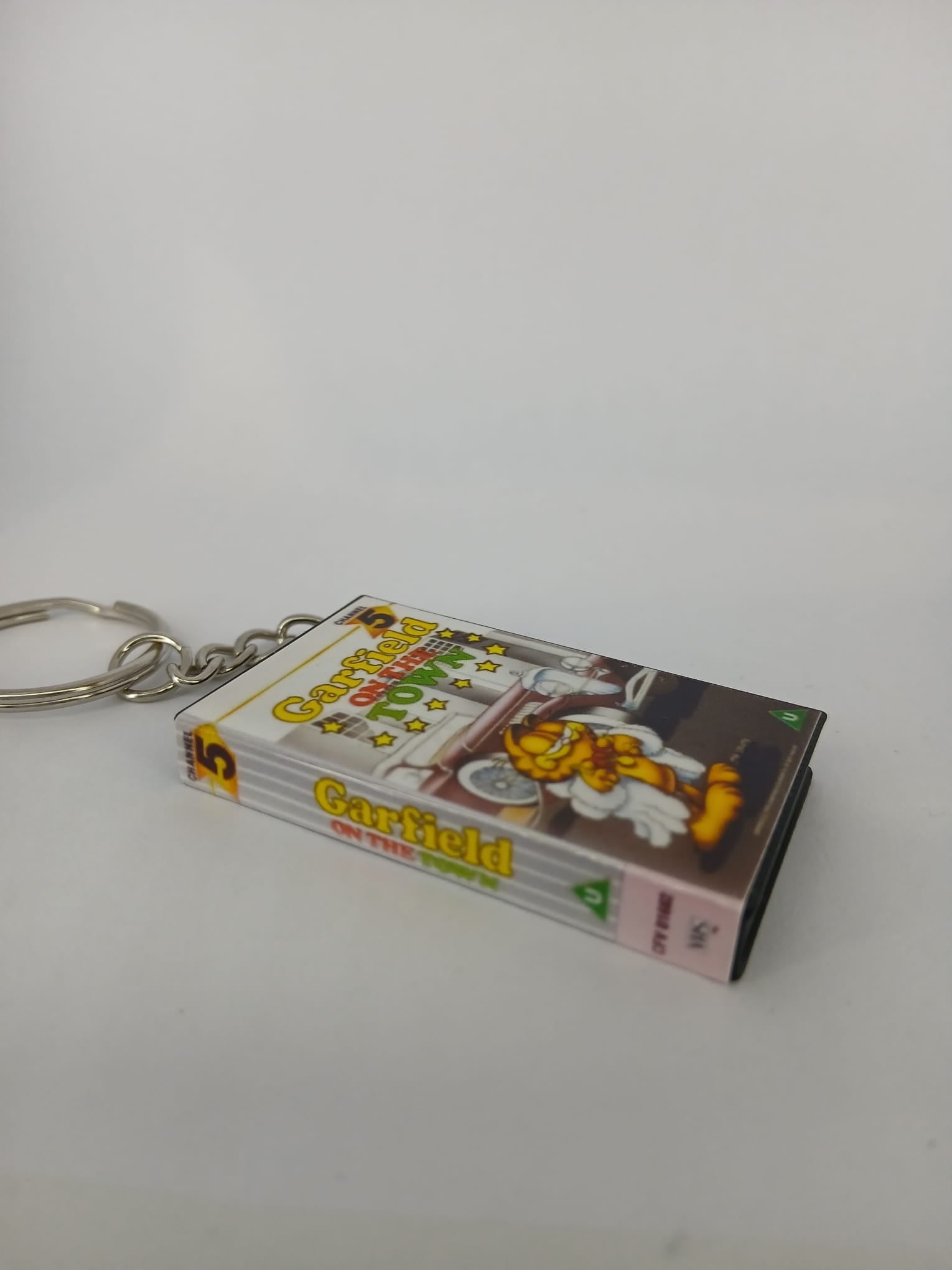 Garfield on the Town VHS keyring — front and spine angled view standing