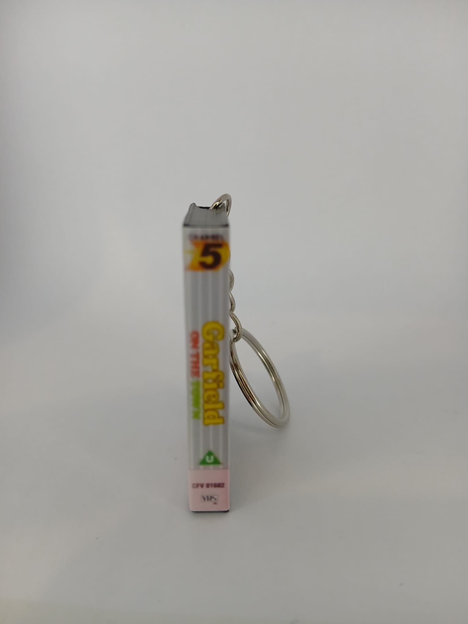 Garfield on the Town VHS keyring — front cover standing angled