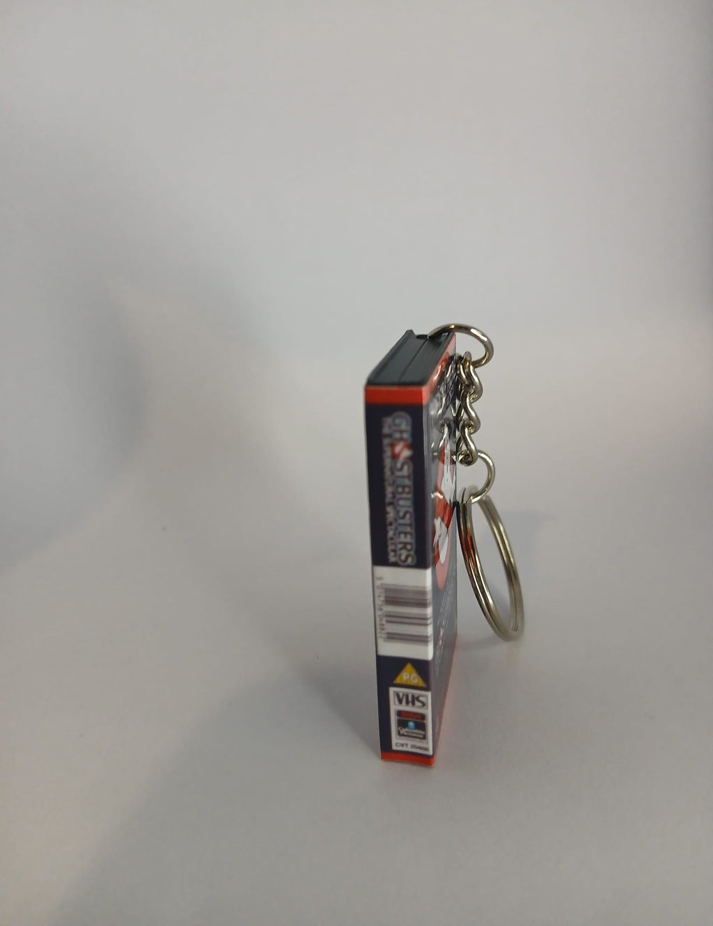 Ghostbusters Mini VHS Keyring – flat lay overhead