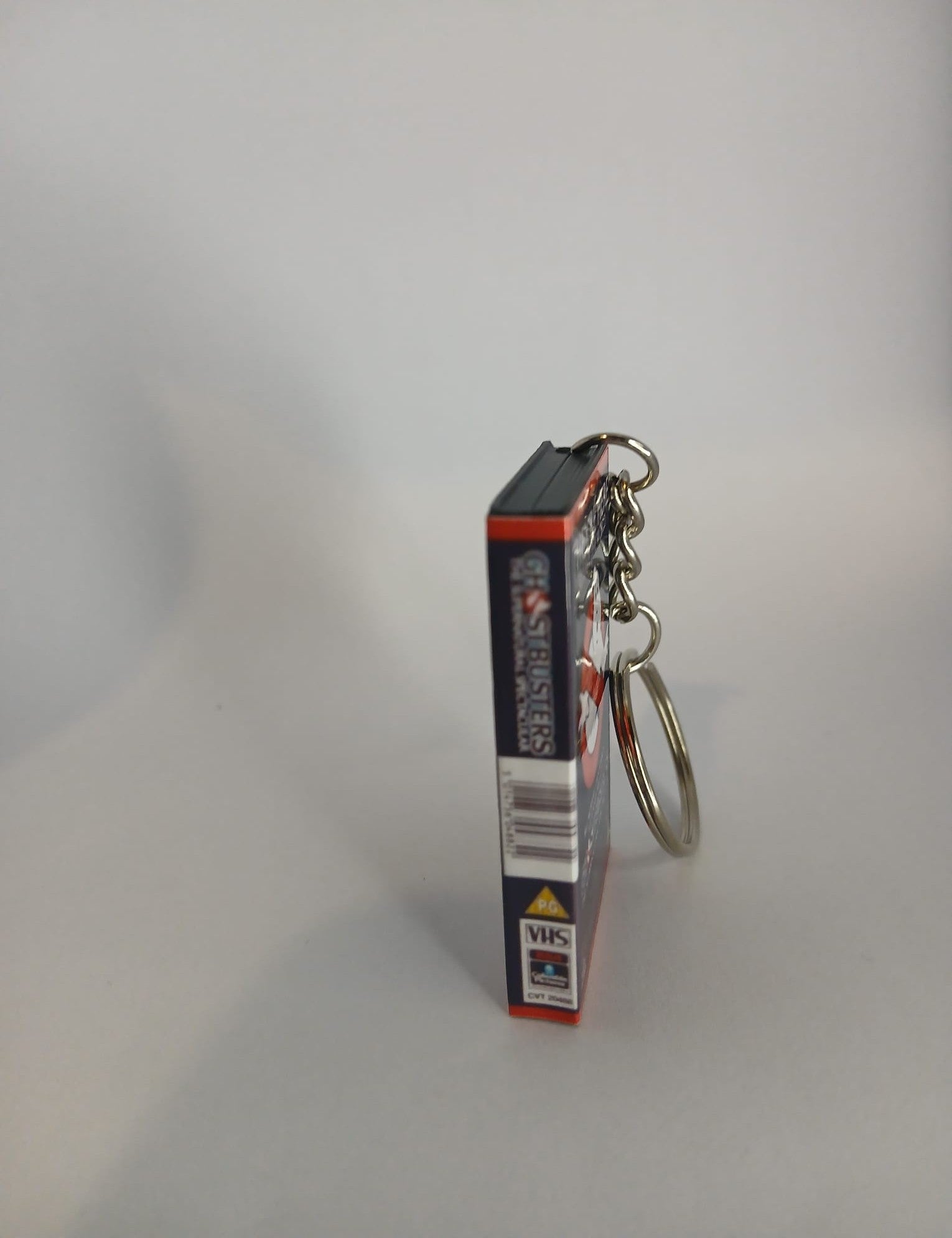 Ghostbusters Mini VHS Keyring – flat lay overhead