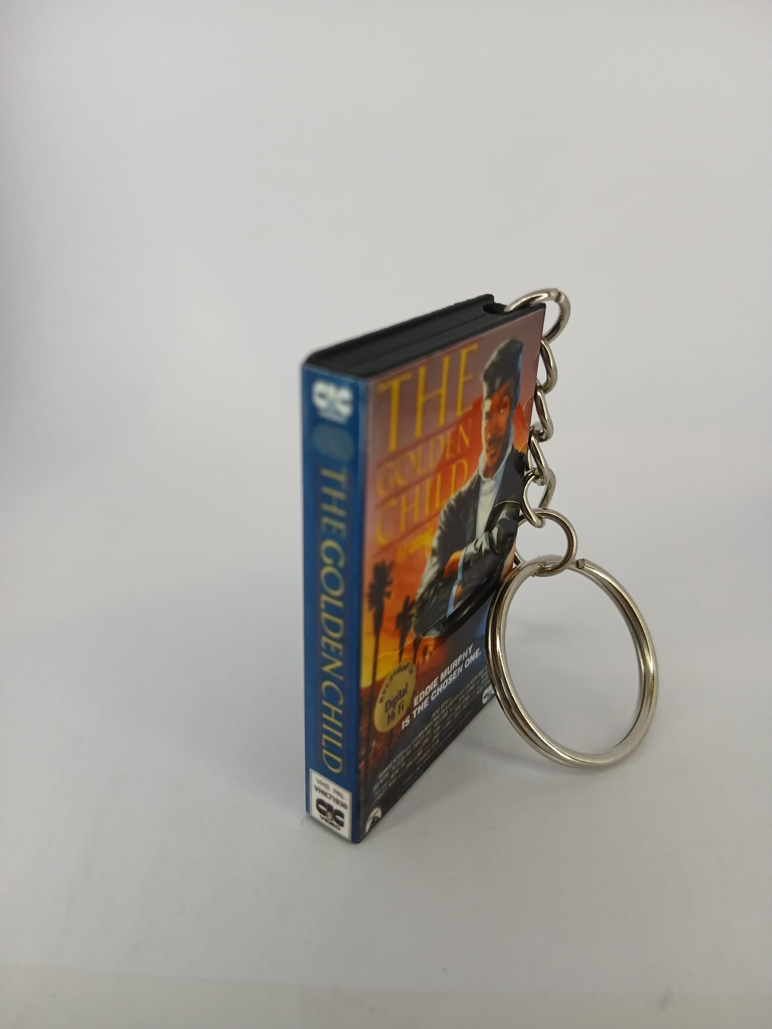 The Golden Child VHS keyring — front cover standing angled 2