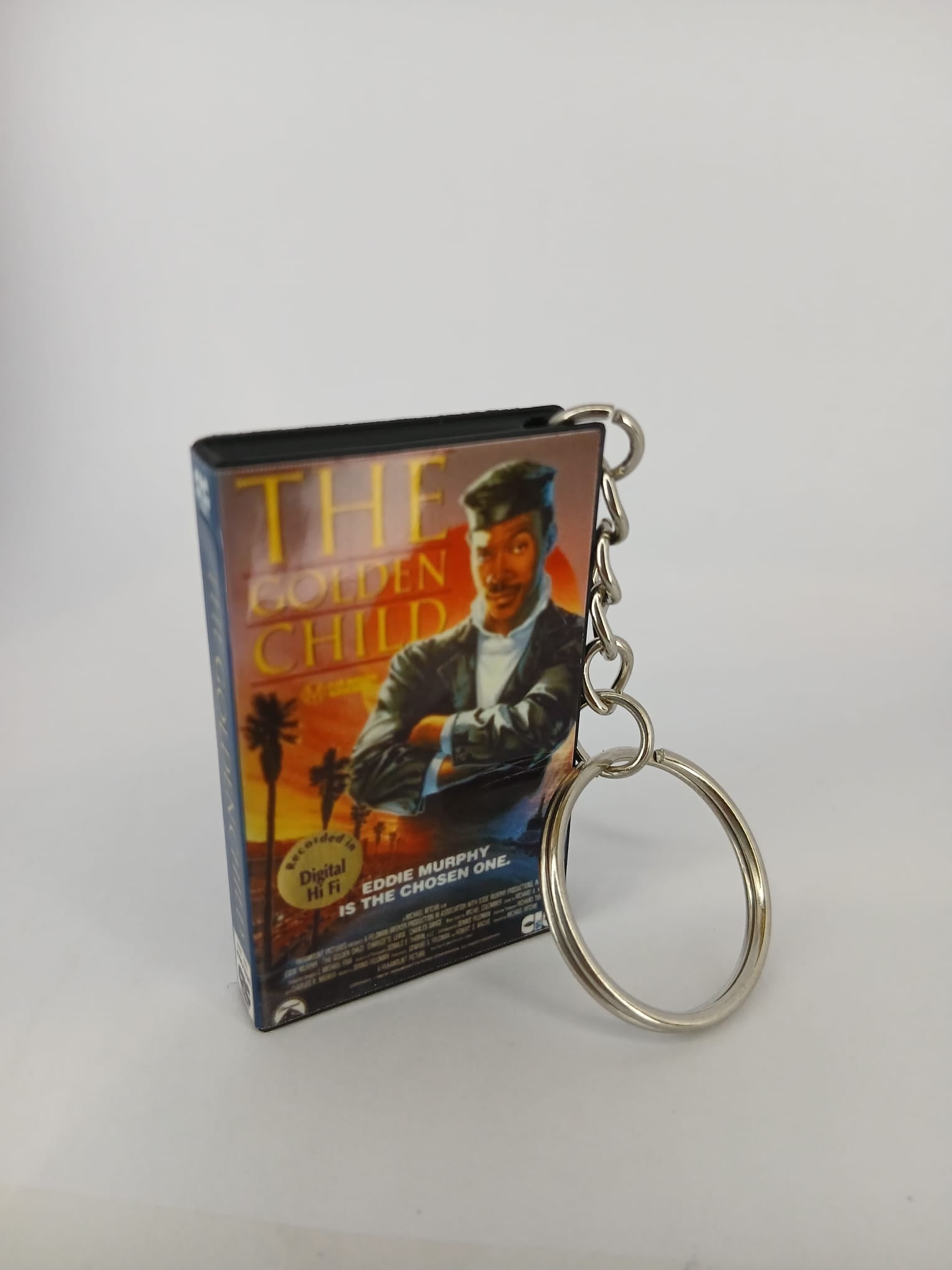 The Golden Child VHS keyring — front cover standing angled 3