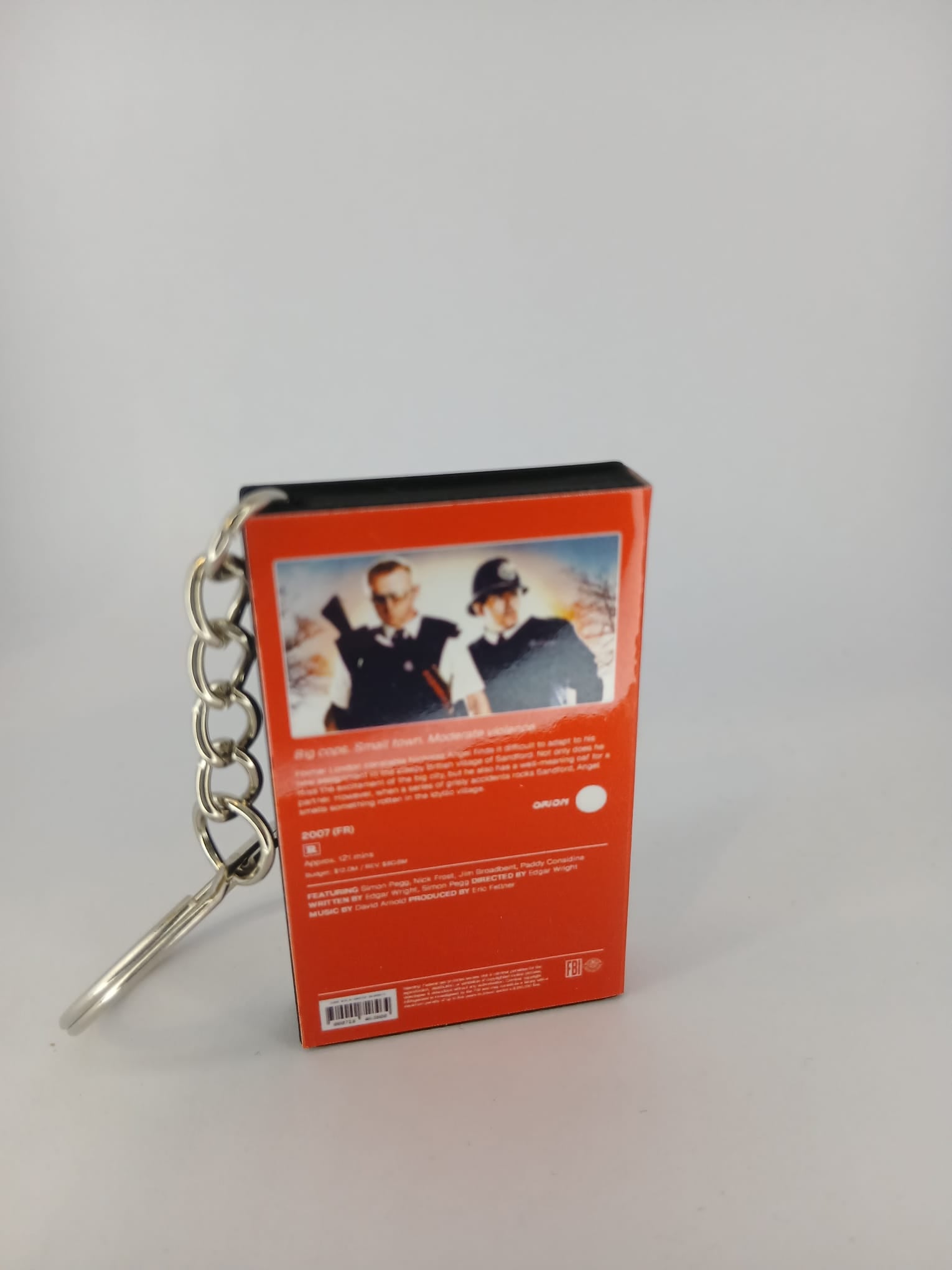 Hot Fuzz VHS keyring — back and spine angled view