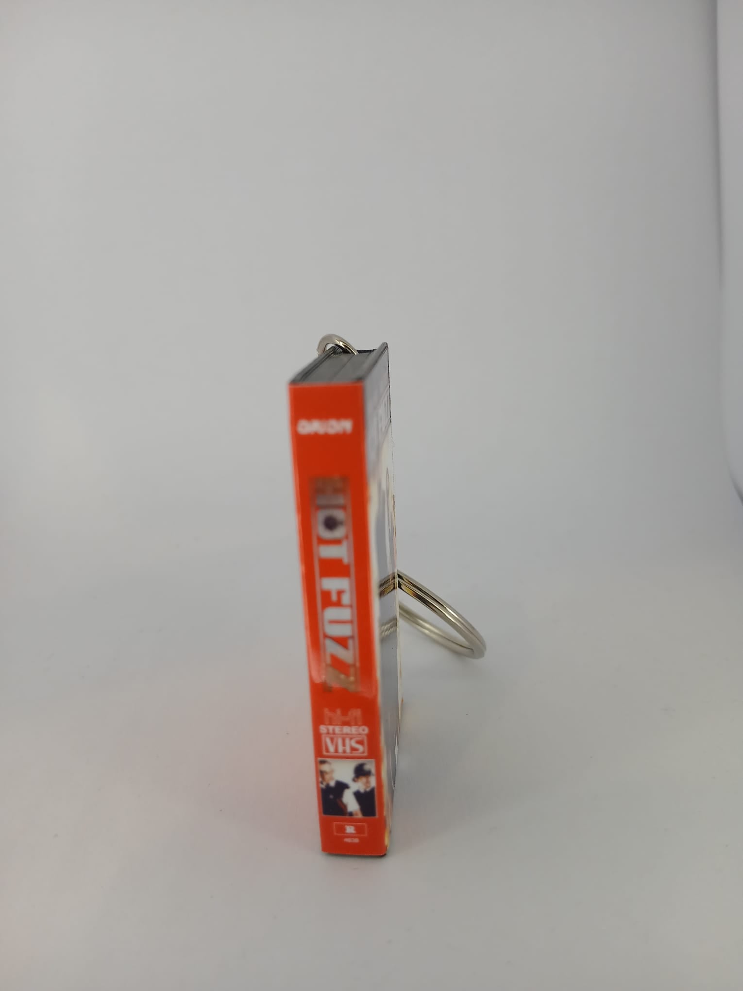 Hot Fuzz VHS keyring — front cover flat lay angled