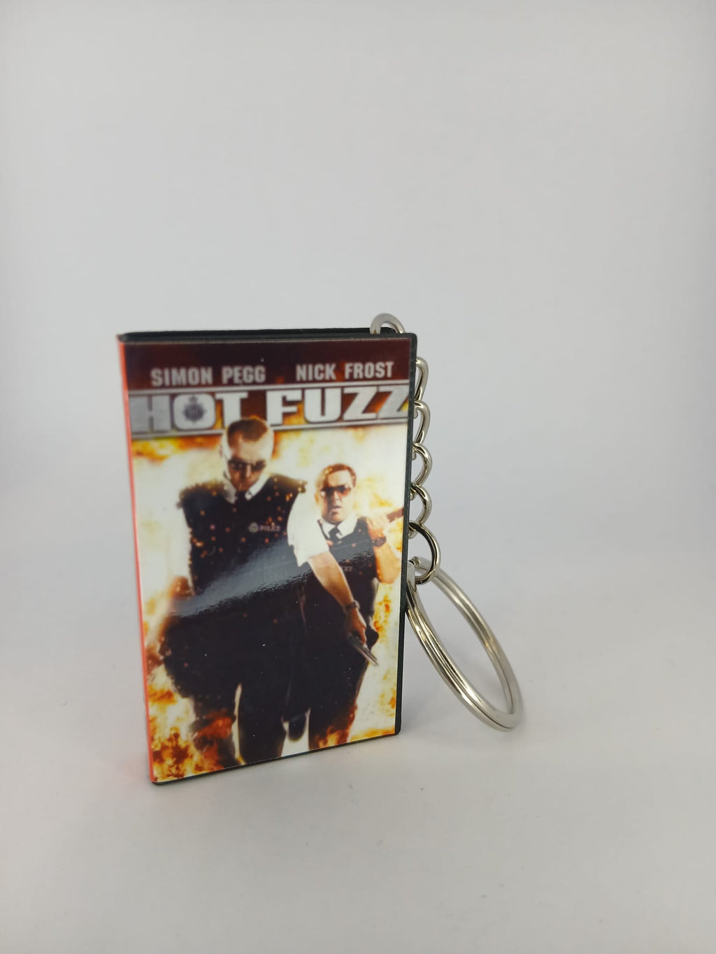 Hot Fuzz VHS keyring — front cover with 1p coin for scale