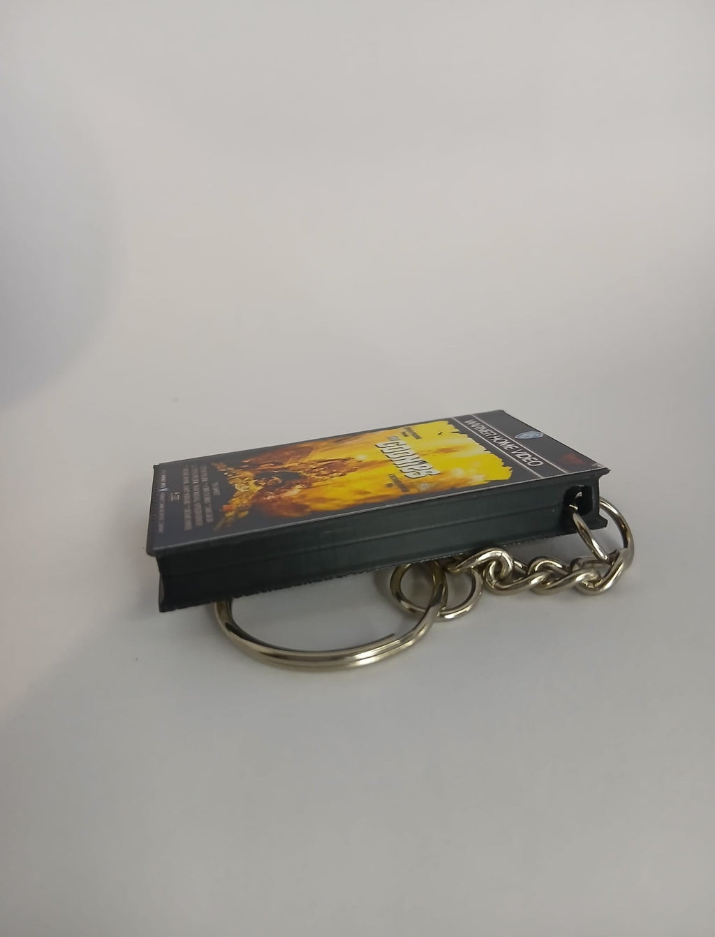 The Goonies VHS keyring — front cover standing angled