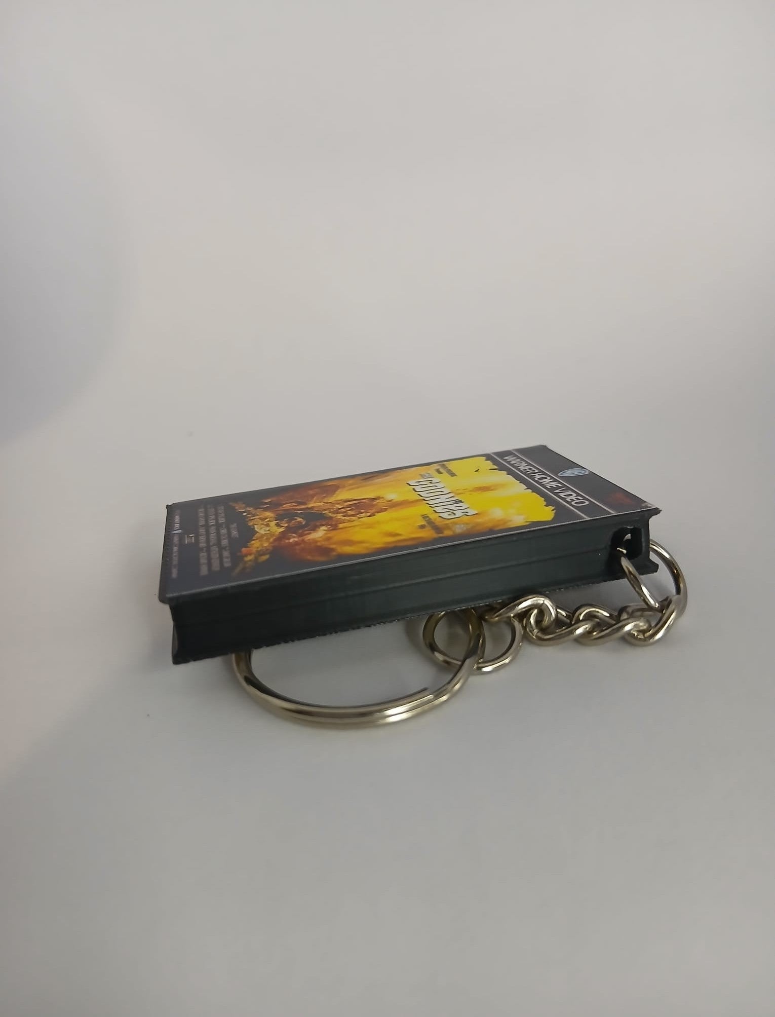 The Goonies VHS keyring — front cover standing angled