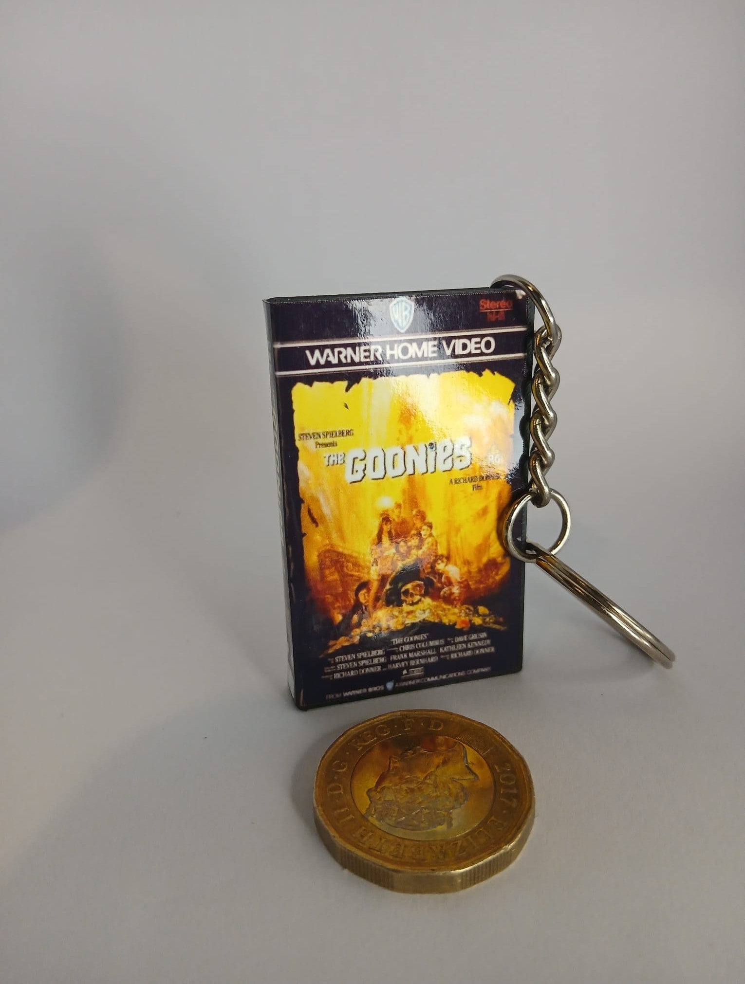 The Goonies VHS keyring — front and spine angled view standing