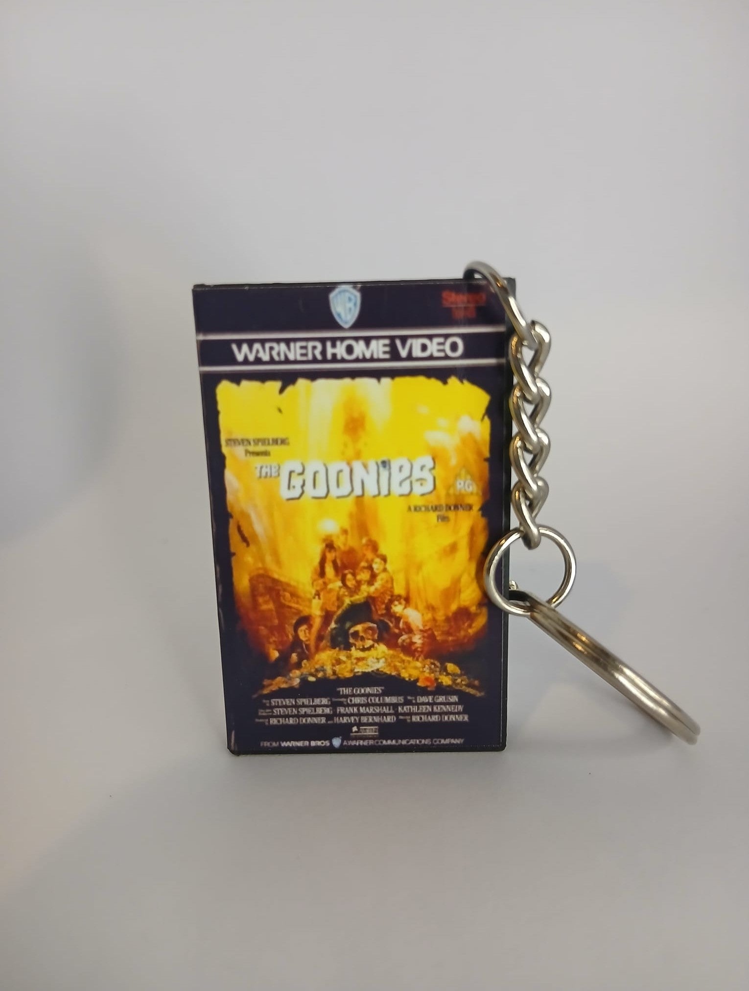 The Goonies VHS keyring — spine view standing