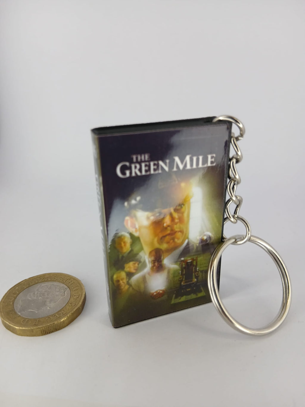 The Green Mile VHS keyring — front cover with £1 coin for scale