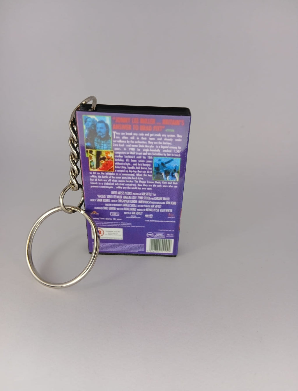 Hackers VHS keyring — spine view standing