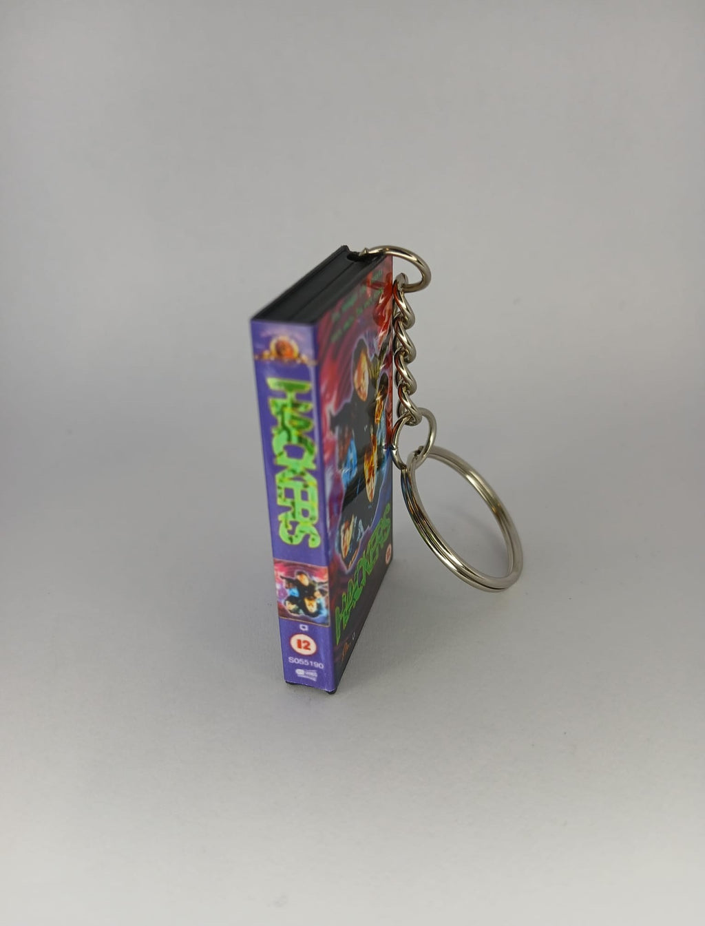 Hackers VHS keyring — flat lay full wrap overview