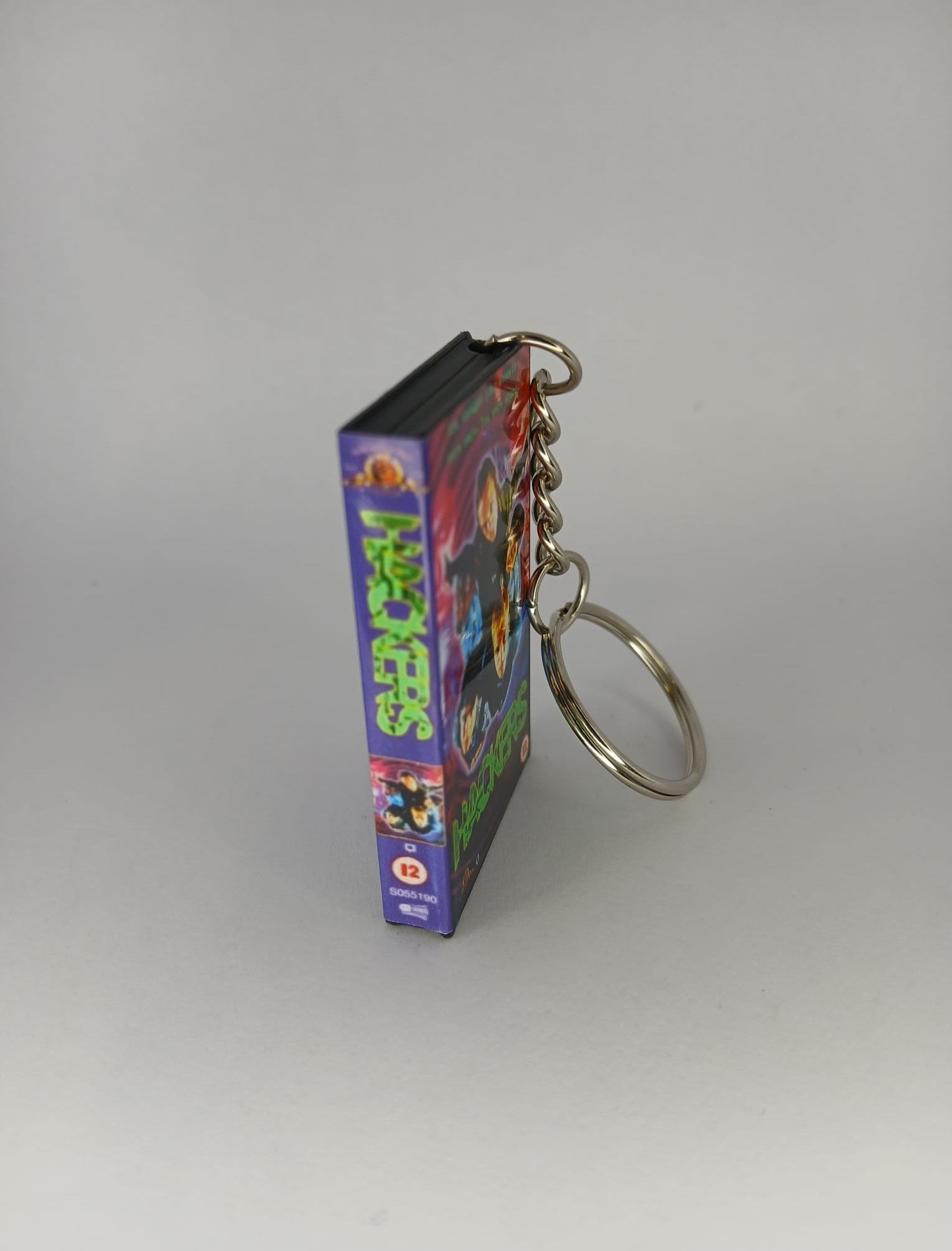 Hackers VHS keyring — flat lay full wrap overview