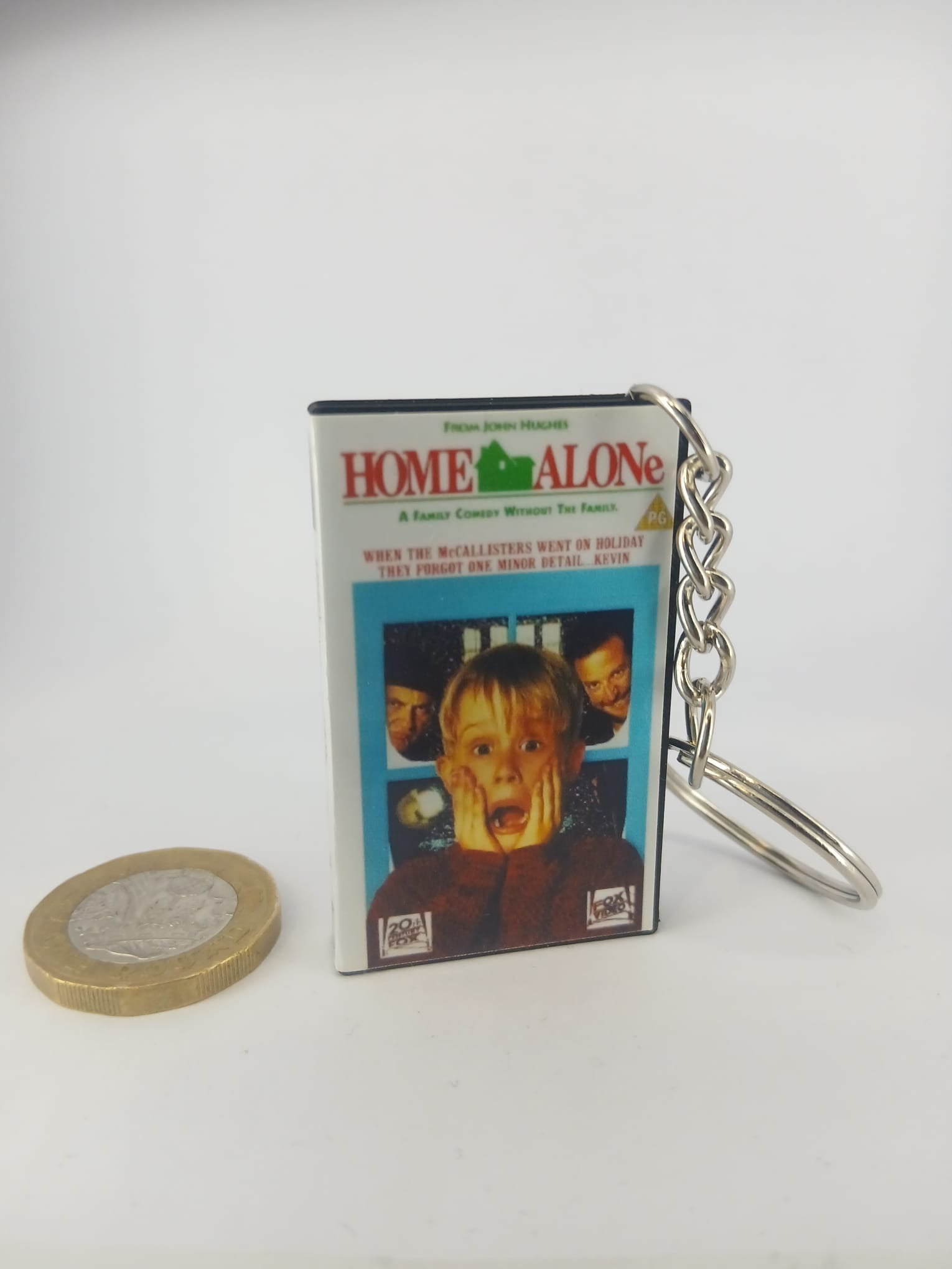 Home Alone VHS keyring — back cover angled view standing