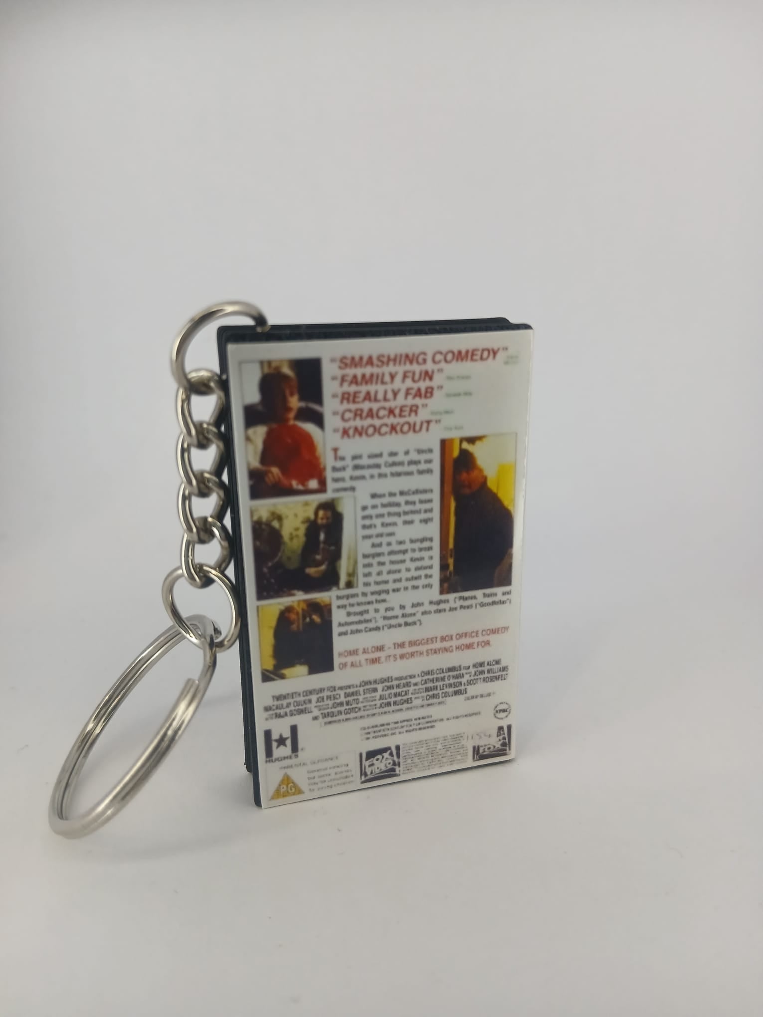 Home Alone VHS keyring — spine view standing
