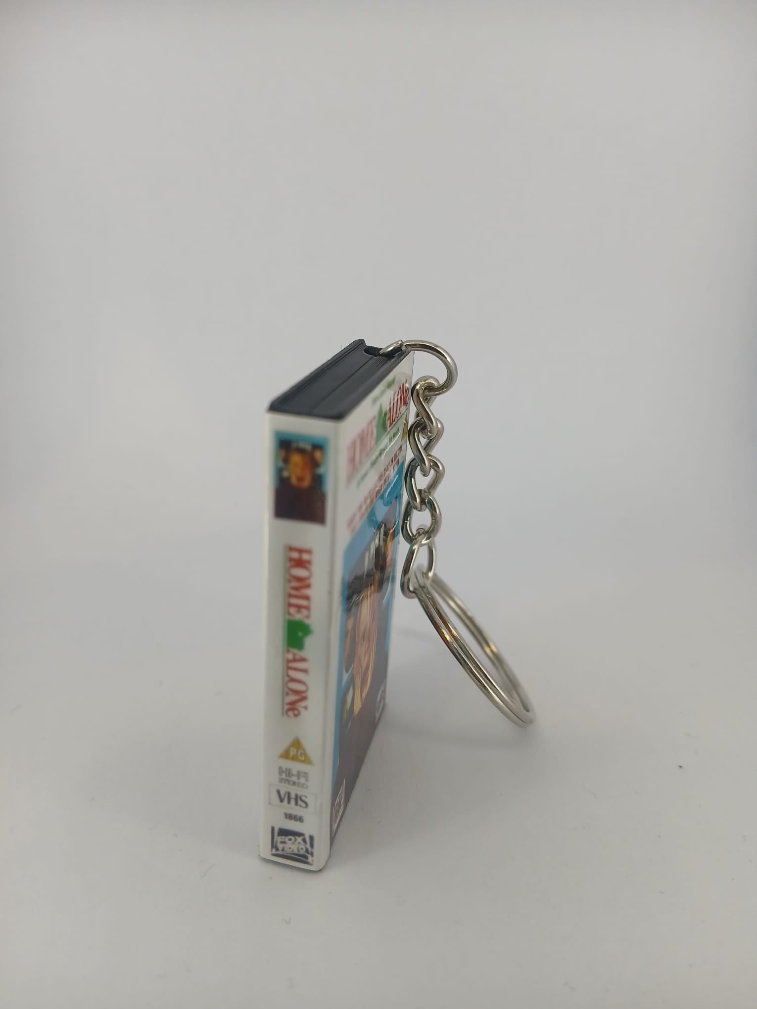 Home Alone VHS keyring — front cover standing angled 2