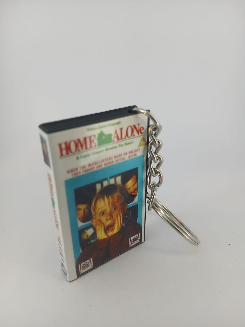 Home Alone VHS keyring — spine close-up standing