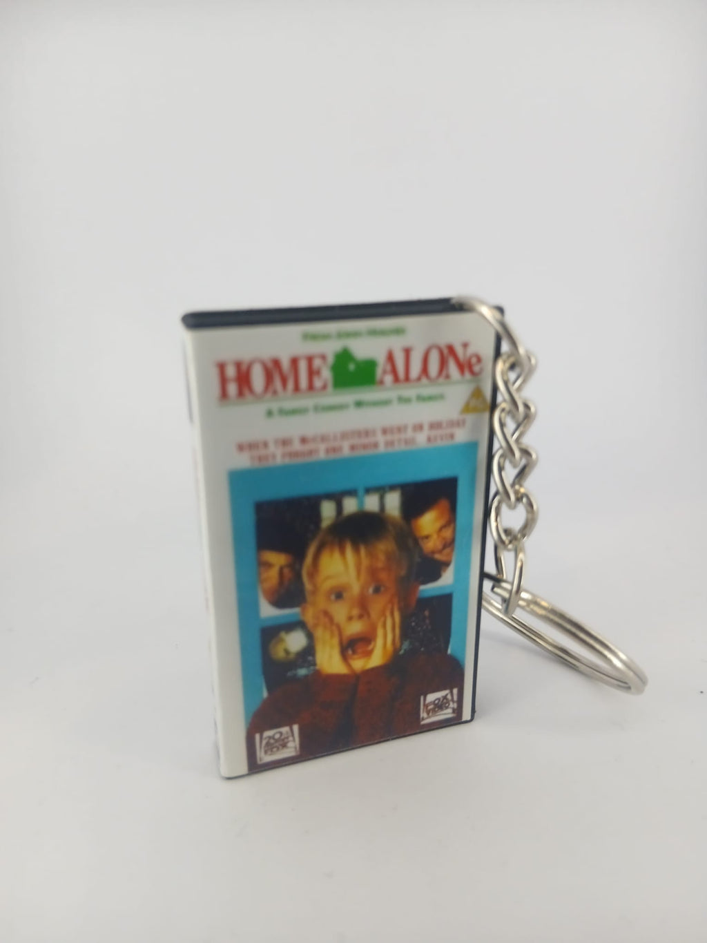 Home Alone VHS keyring — front cover standing angled 3