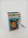 Home Alone VHS keyring — front cover standing angled 3