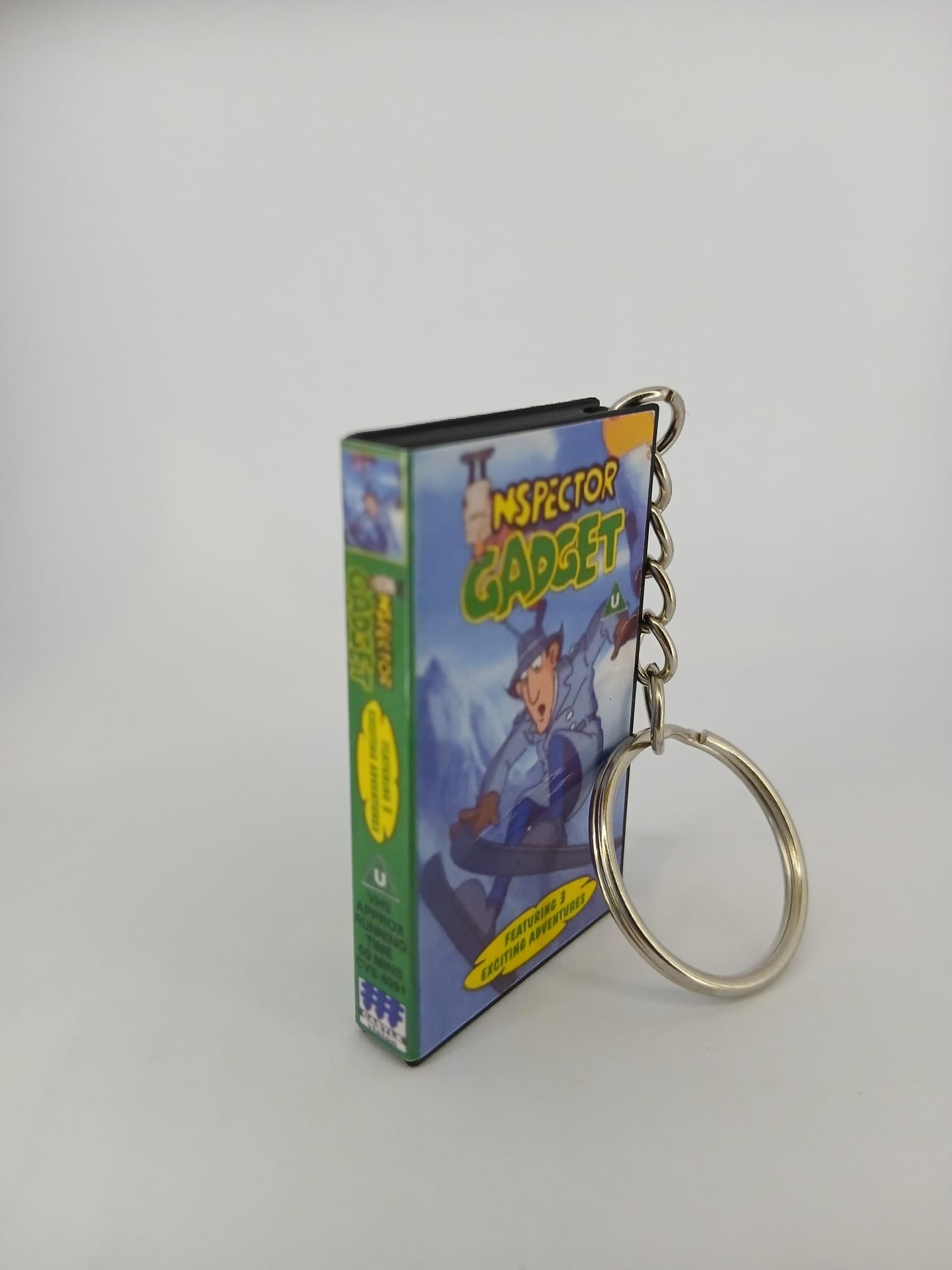 Inspector Gadget VHS keyring — back cover angled view standing