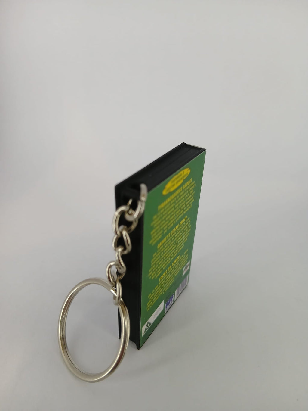 Inspector Gadget VHS keyring — back and spine angled view standing