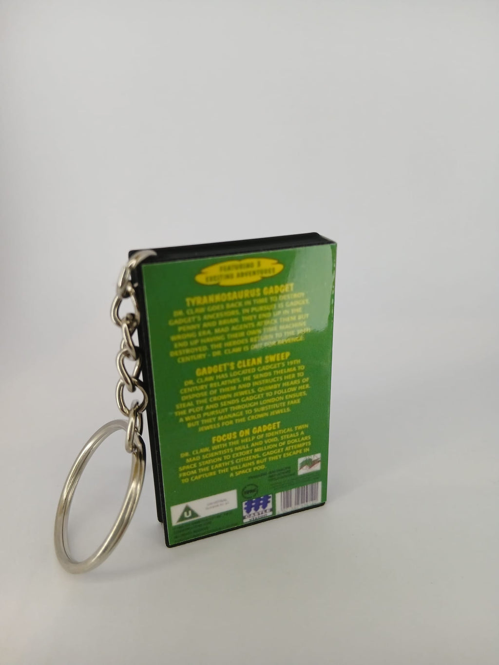 Inspector Gadget VHS keyring — spine view standing
