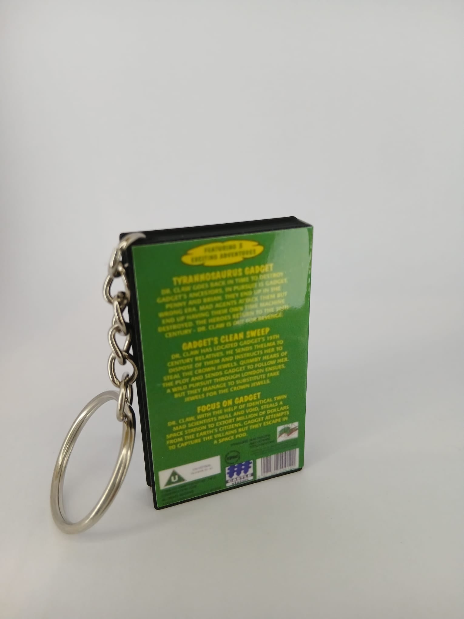 Inspector Gadget VHS keyring — spine view standing