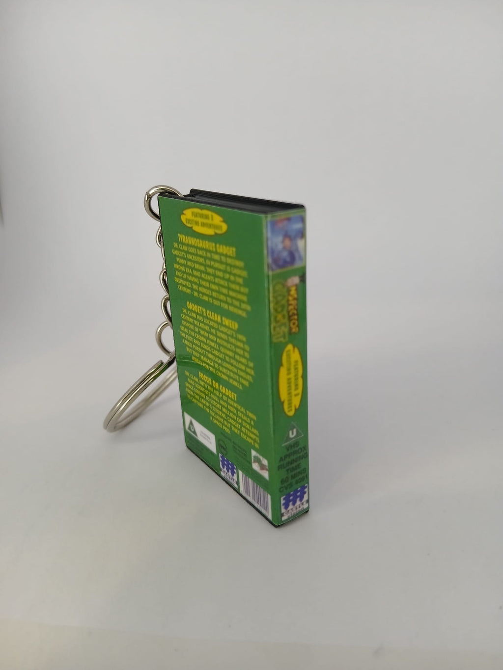 Inspector Gadget VHS keyring — flat lay front and spine angled