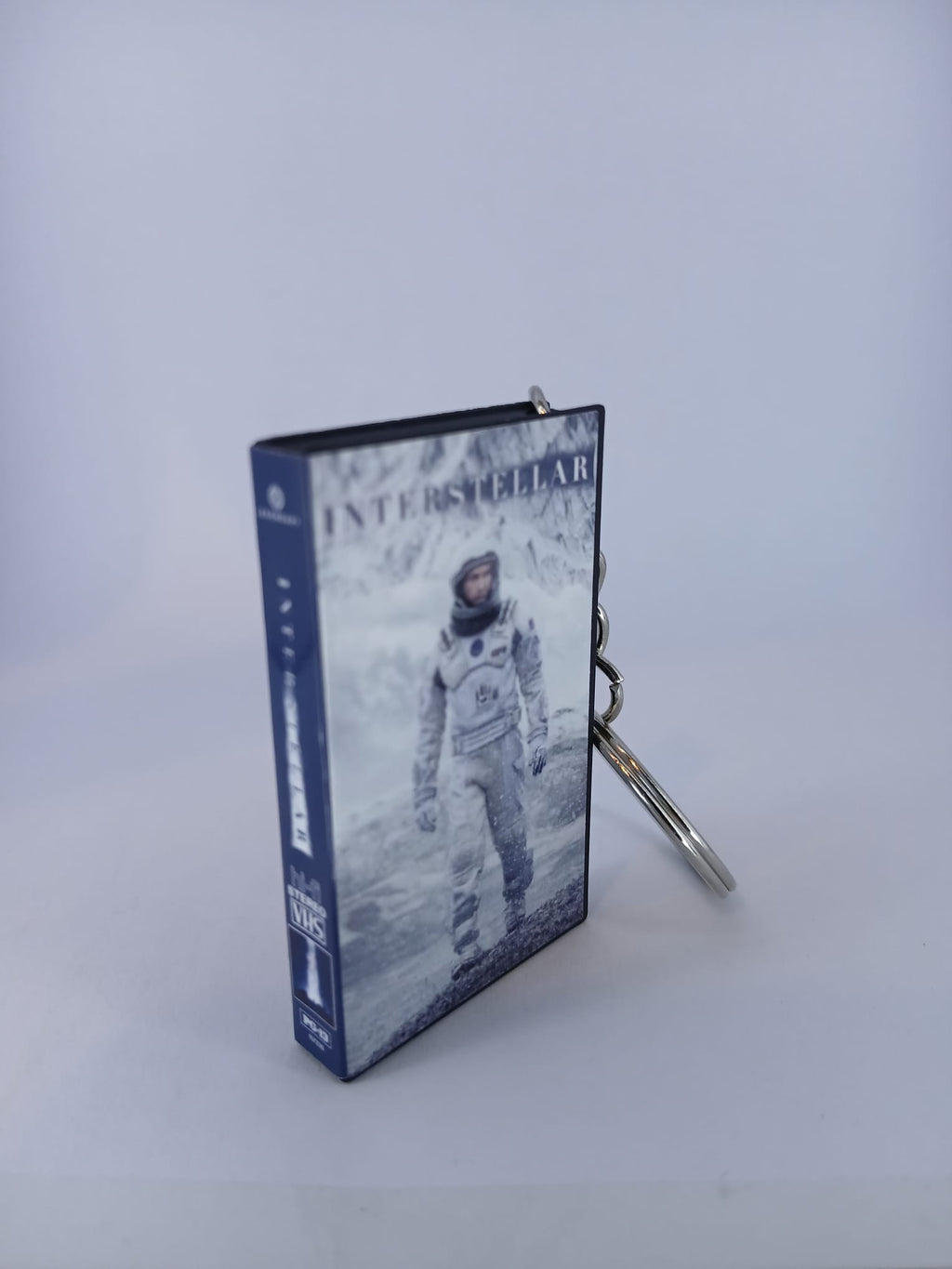 Interstellar VHS keyring — front cover standing angled
